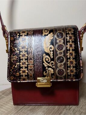 Ornate Burgundy gold and Black Embossed Shoulder Bag. Calja